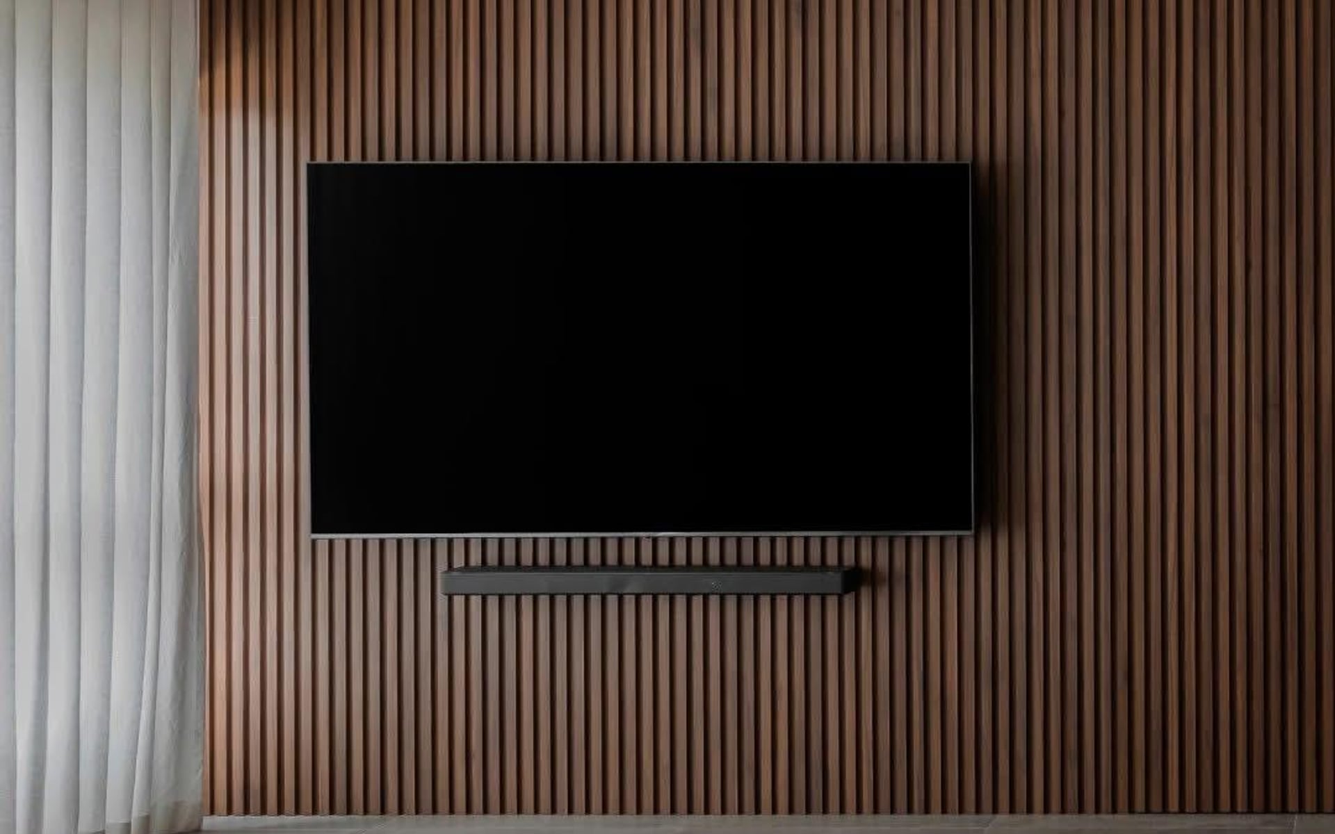 Completed television feature wall showing visible equipment positions that depend on coordinated electrical points